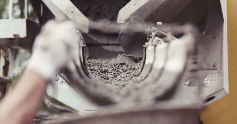 Picture of self consolidating concrete flowing out of a pumping truck