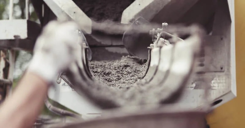 Self Consolidating Concrete Picture of self consolidating concrete flowing out of a pumping truck